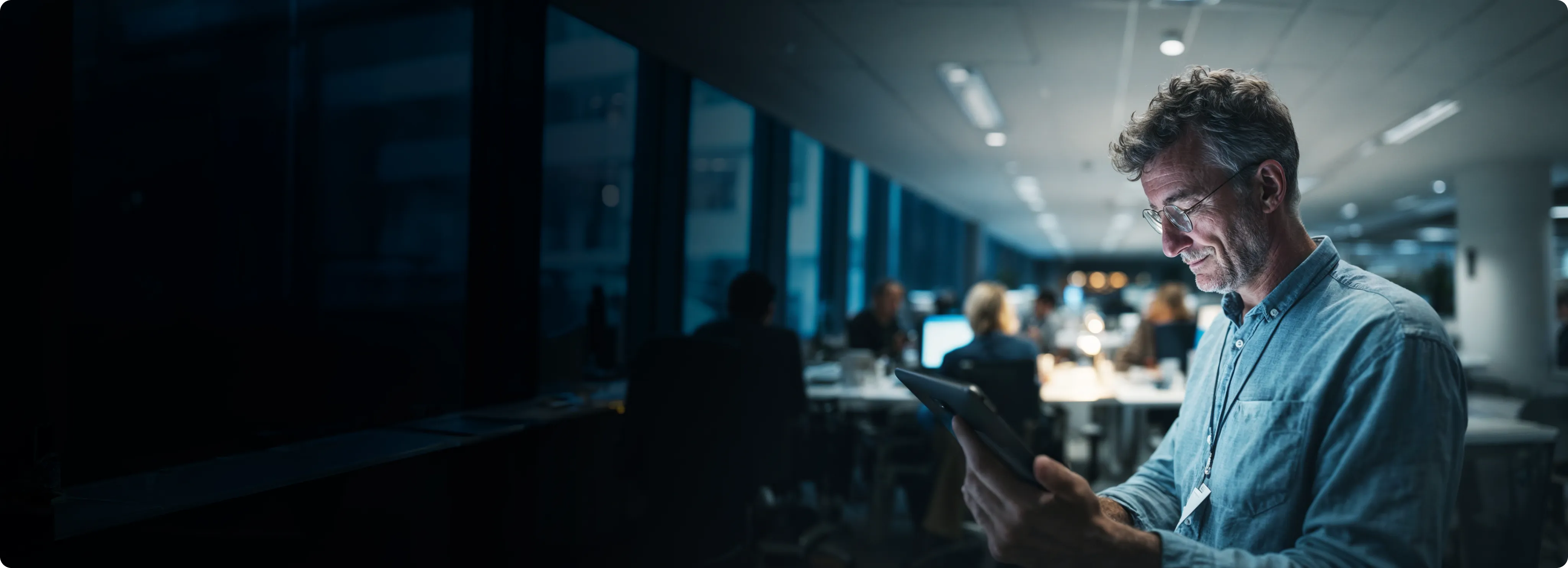 Person reviewing benefits data on a tablet in an office